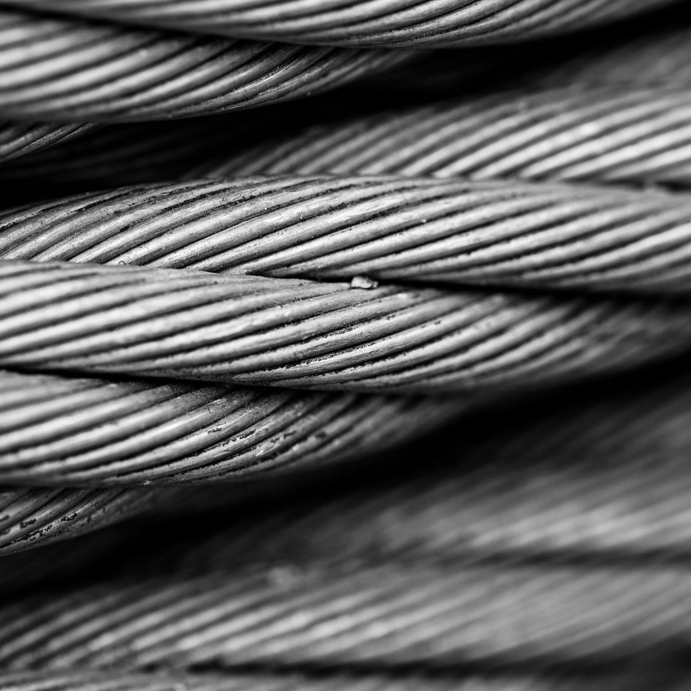 Close-up of stranded steel hoist rope showing the lay of the outer strands